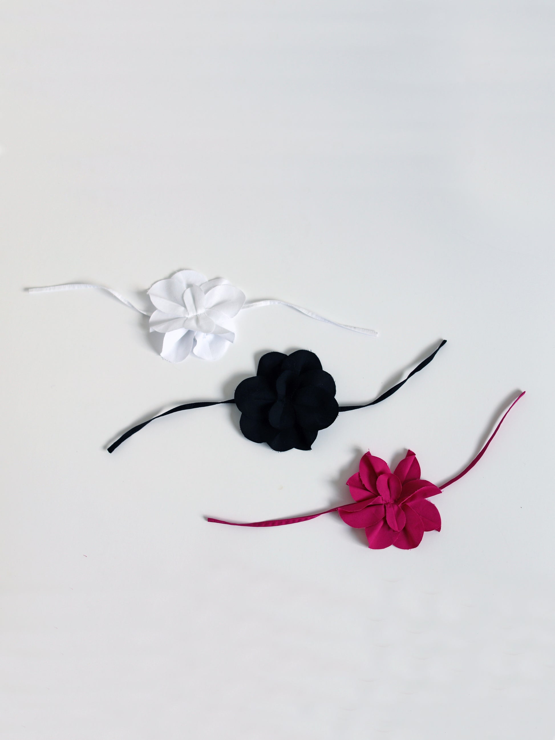 Blue Nude ~ Slow Fashion Brand - Camellia Flower Tie Brooches in White, Noir Black, and Magenta Pink